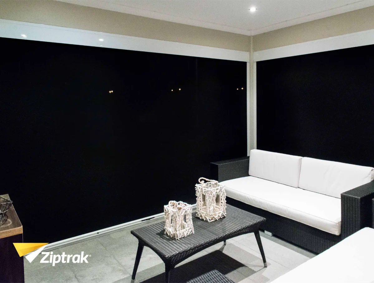 Warm enclosed patio on a winter morning with block-out Ziptrak blinds trapping heat.